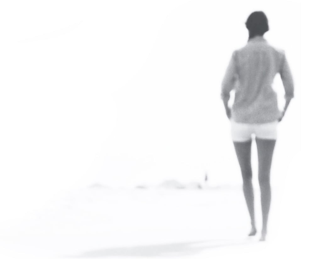 Woman walking on beach